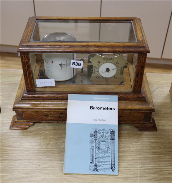 An Edwardian Art Nouveau barograph, inlaid with ebony, brass and copper, possibly Glasgow School, width 43cm